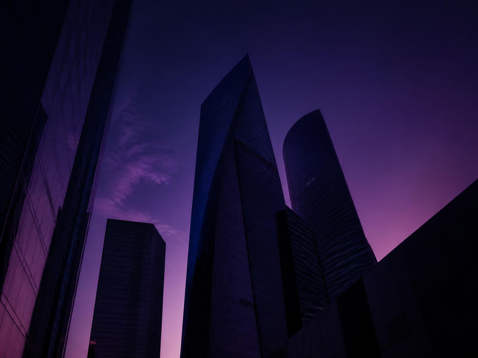 Modern city skyline at dusk representing real estate investment